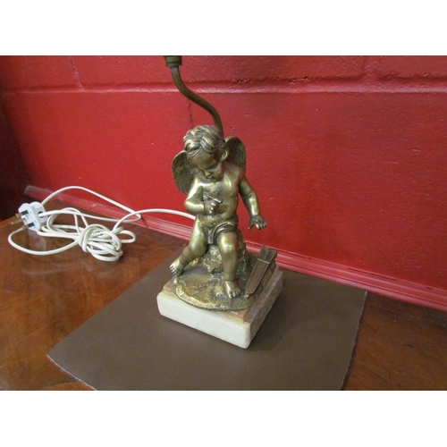 4262 - A brass table lamp base, sculptural form Cupid