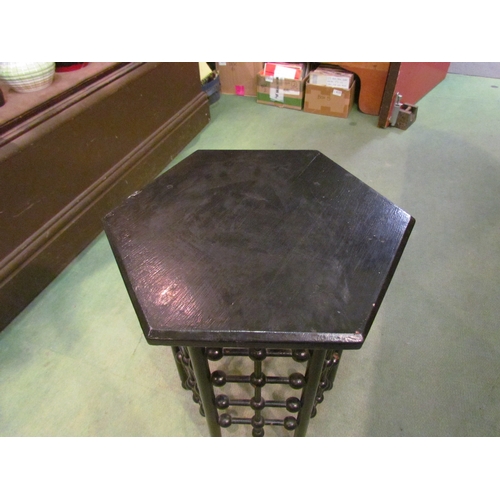 4266 - A ball design ebonised occasional table with hexagonal top, 48cm tall x 36cm diameter