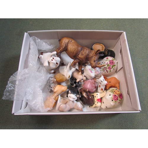 4275 - A box of miscellaneous to include ceramic pigs, Goebel rabbit, rabbit eating lettuce, black and whit... 