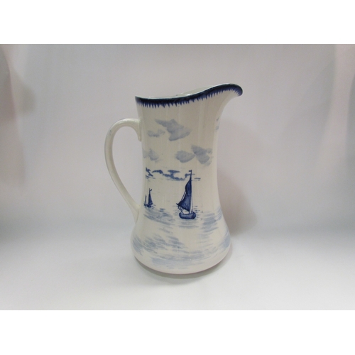 4317 - An empire ware blue and white wash jug depicting Dutch windmill scene, 29.9cm tall