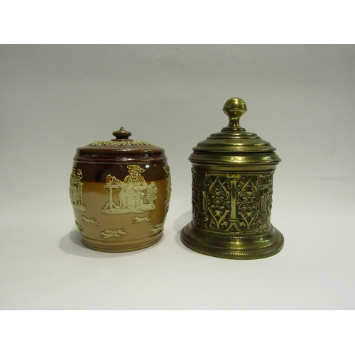 4462 - A Doulton Lambeth harvest ware tobacco jar and a brass example (2)