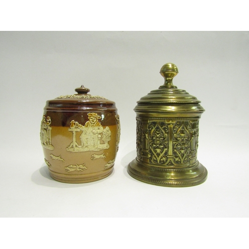 4462 - A Doulton Lambeth harvest ware tobacco jar and a brass example (2)