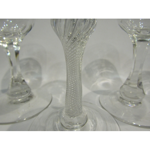 4467 - Four drinking glasses, each etched with vine, including a late 18th Century example with air twist s... 