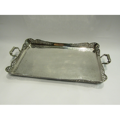 4468 - An Edwardian Maple & Co., London silver plated tray, 52cm long