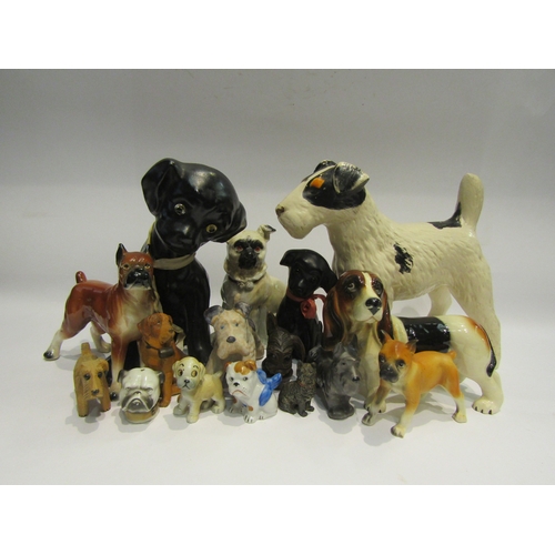 4475 - A box of miscellaneous dog figures to include Black Forest, ceramic and metal examples