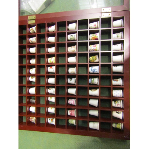 4478 - Three display cases containing ceramic thimbles