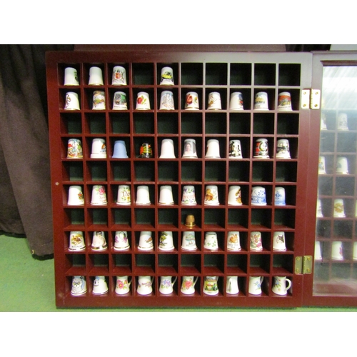 4478 - Three display cases containing ceramic thimbles