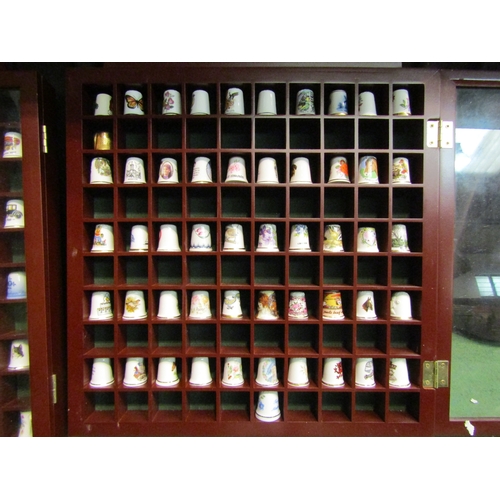 4478 - Three display cases containing ceramic thimbles