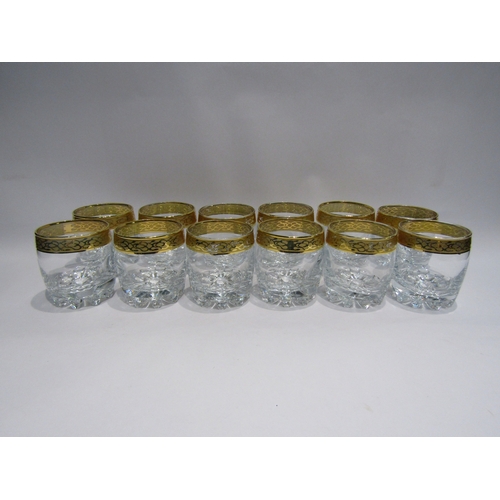 4487 - A set of twelve heavy whisky glasses with gilt rims