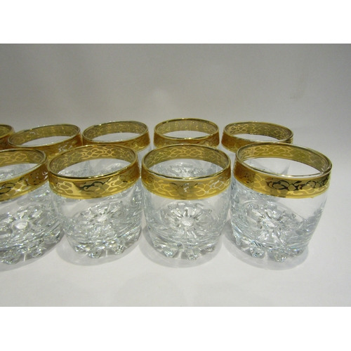 4487 - A set of twelve heavy whisky glasses with gilt rims