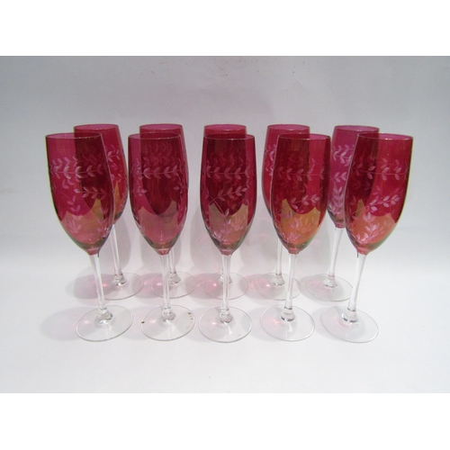 4498 - A set of ten 20th Century cranberry cut glass champagne flutes