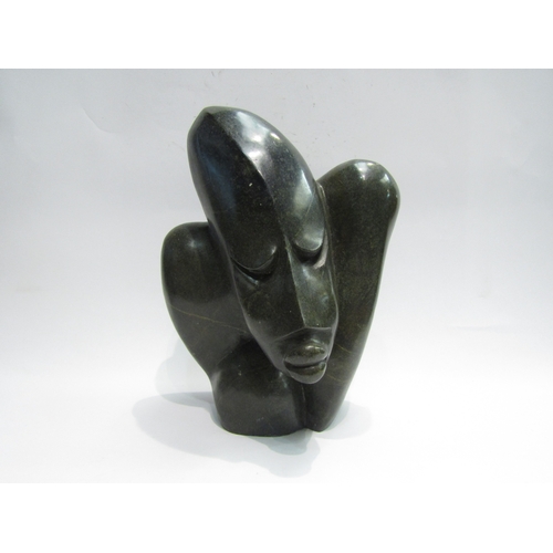 4507 - A modernist abstract carved stone sculpture of a figure, 33cm tall