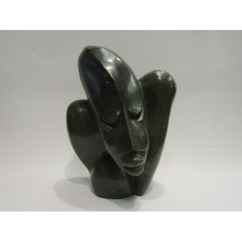 4507 - A modernist abstract carved stone sculpture of a figure, 33cm tall