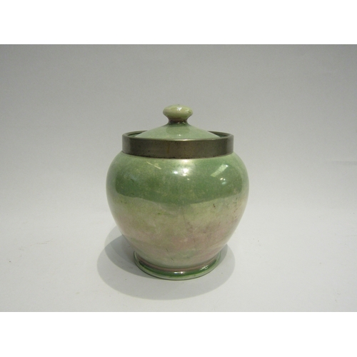 4526 - A Moorcroft Burslem canister, mottled green glaze with plated rim