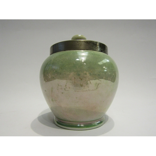 4526 - A Moorcroft Burslem canister, mottled green glaze with plated rim