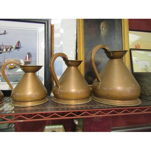 4337 - A quantity of copper measure jugs, various graduating sizes (8)