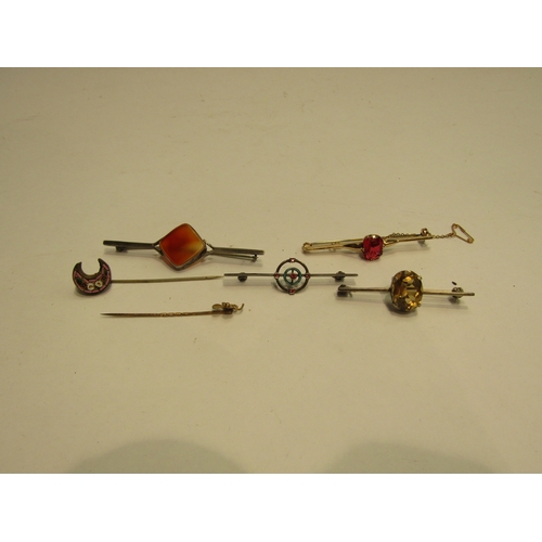 4434 - A 9ct gold bar brooch set with red stone. A bar brooch set with citrine bar stamped sterling silver.... 