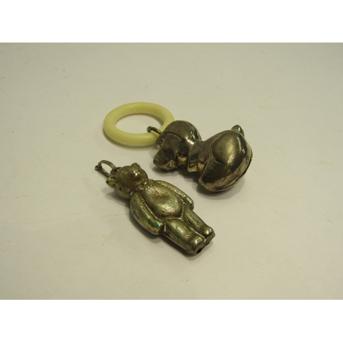 4435 - A plated babies rattle as a hound on plastic ring and an EPNS teddy bear rattle pendant (2)