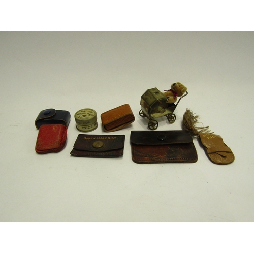 4437 - A bag of miniature items to include leather pouch 