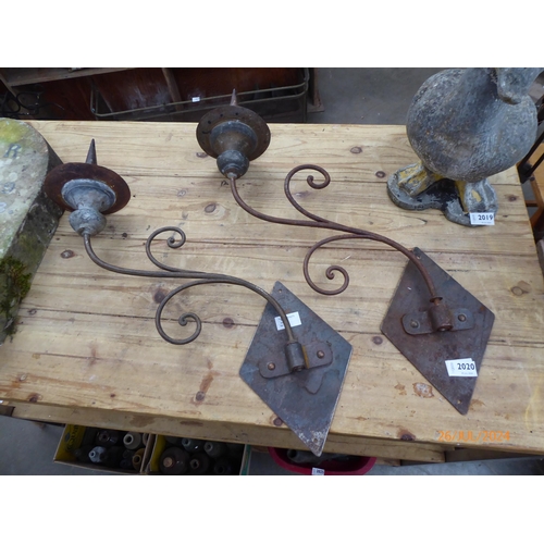 2020 - A pair of wrought iron pricket wall scounces