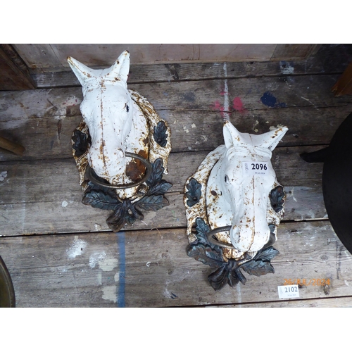 2096 - A pair of cast iron wall mounted horse head plaques