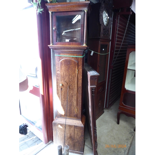 2107 - A Georgian oak longcase clock case with pendulum, weights, no movement