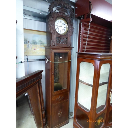 2109 - An early 20th Century carved oak grandfather clock with key, weights and pendulum, R.Brunel a Lunera... 