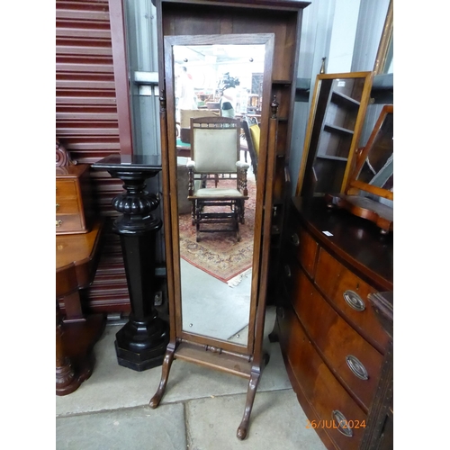 2115 - A mahogany cheval mirror with urn finials