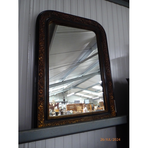 2119 - A large French ebonised floral mirror with beaded details