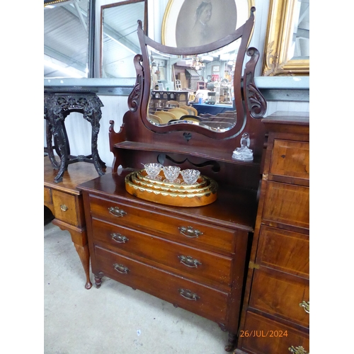 2140 - An Edwardian walnut dressing chest with central shaped and bevelled glass mirror