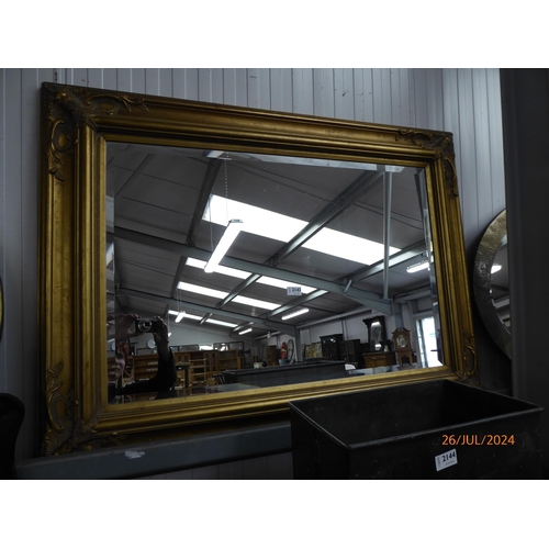 2143 - An ornate gilt framed mirror 118 x 88cm