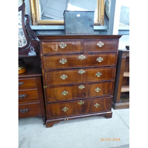 2145 - A Georgian walnut chest of two short over four long drawers, brass fretwork handles, satinwood bandi... 