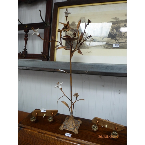 2165 - A gold painted metal candle stick with ceramic flowers