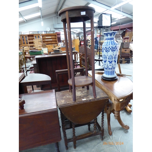 2181 - A barley twist gate leg table together with a two tier mahogany plant stand