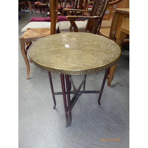 2182 - An Oriental brass topped table