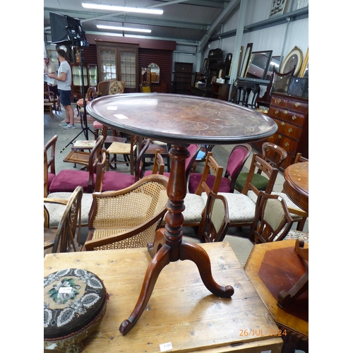 2183 - A 19th Century wine table, the circular dished top over a turned column to tripod base