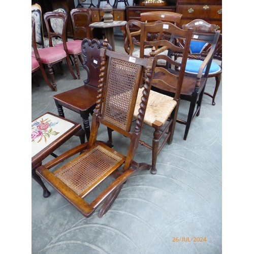 2194 - A victorian mahogany and beech folding campaign chair with cane seat and back and a ladder back coun... 