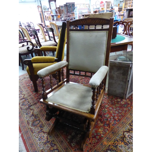 2205 - An Edwardian American walnut rocking chair