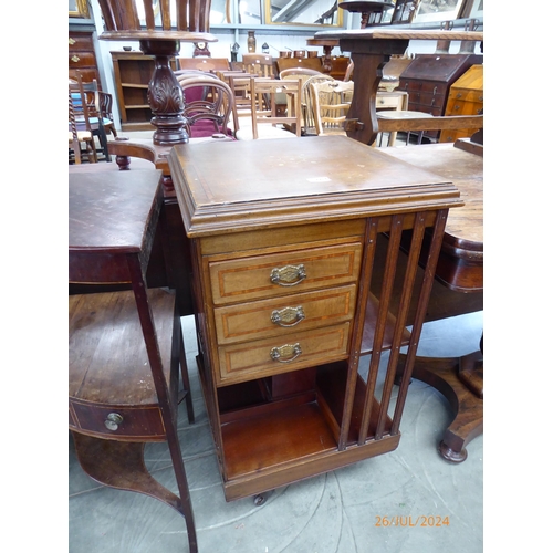 2216 - An Edwardian inlaid mahogany revolving bookcase