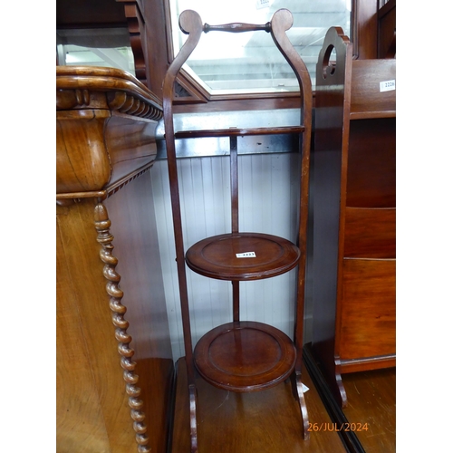 2223 - A 1930's mahogany three tier folding cake stand