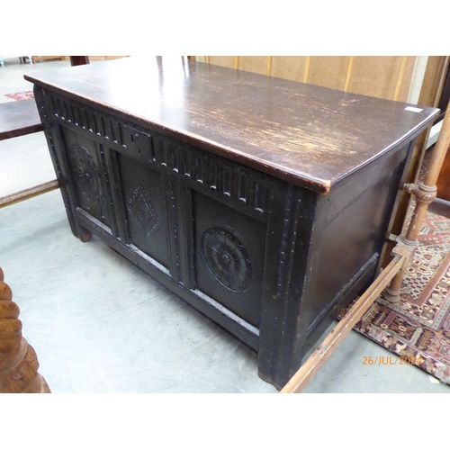 2230 - An 18th Century carved oak coffer with later lid