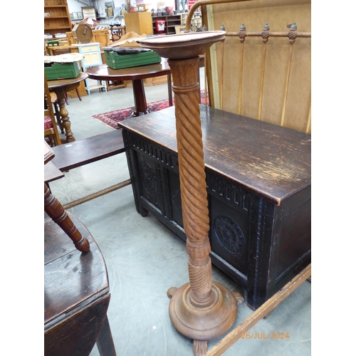 2231 - A carved hardwood torchere stand