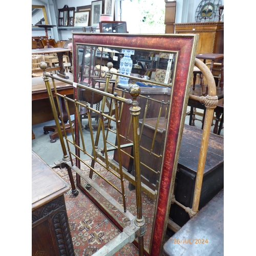 2237 - A large Oriental red and gold lacquered mirror with bevelled glass 106cm x 138cm