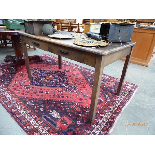 2246 - An early to mid 20th Century oak two drawer desk on square legs