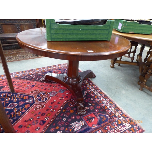 2248 - An early Victorian mahogany tilt top breakfast table with lion paw feet