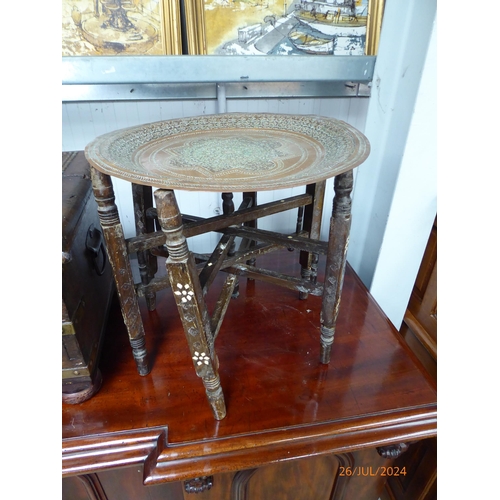 2252 - Two Indian brass topped tables