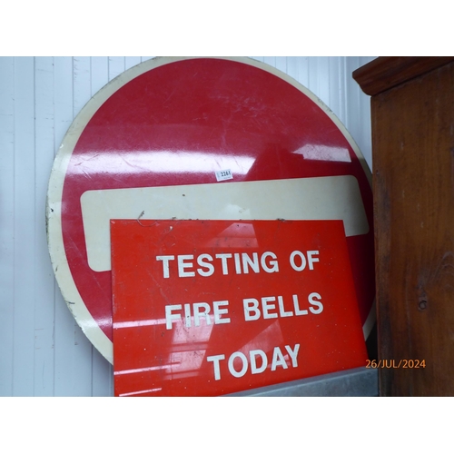 2261 - A large stop sign and a testing of fire bells sign