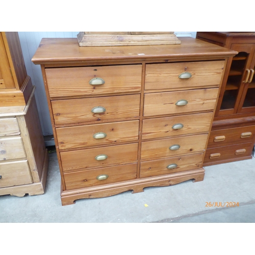 2265 - A pine chest of ten drawers with cup handles