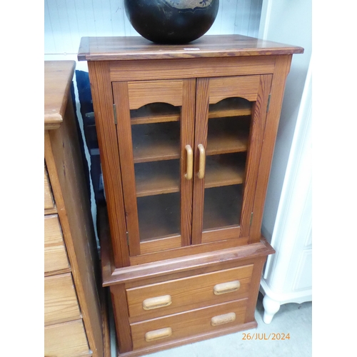 2267 - A pitch pine small cabinet on a two drawer chest