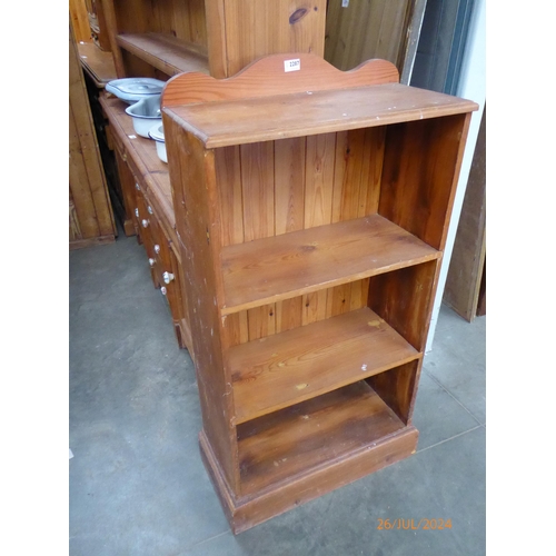 2287 - A pine slim bookcase with plinth base